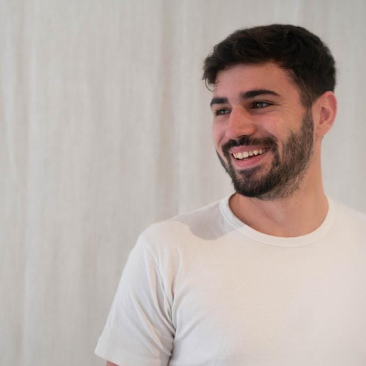 Kaveri Mehta, Lead Design Curator at WharfCraftLoom, reviewing corporate floral arrangements